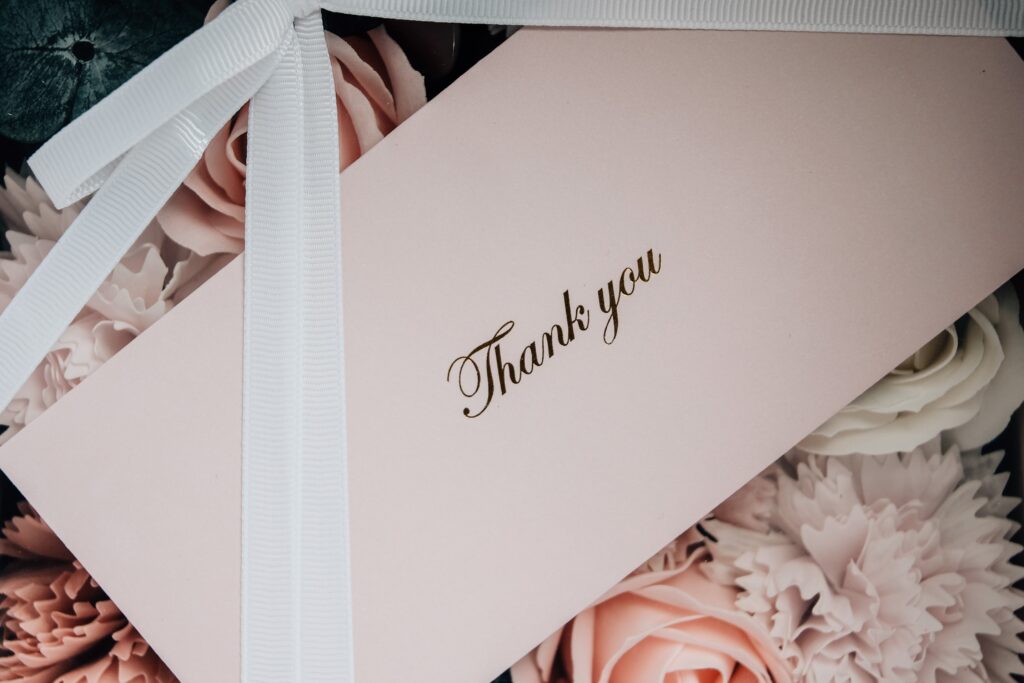 small business thank you card on top of flowers